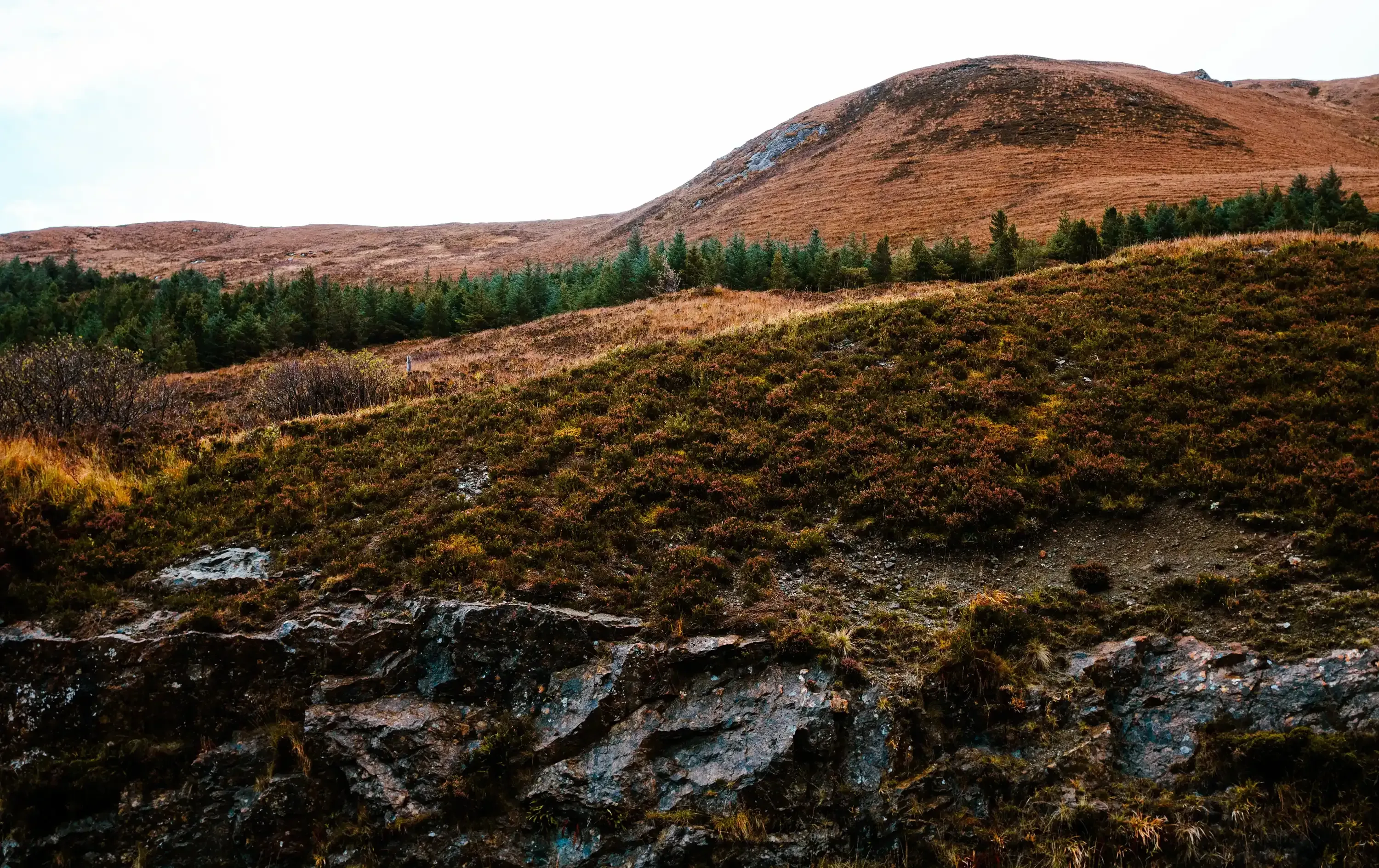 Sweeping, dramatic landscape view of the rugged mountains and coastal scenery on the Isle of Skye