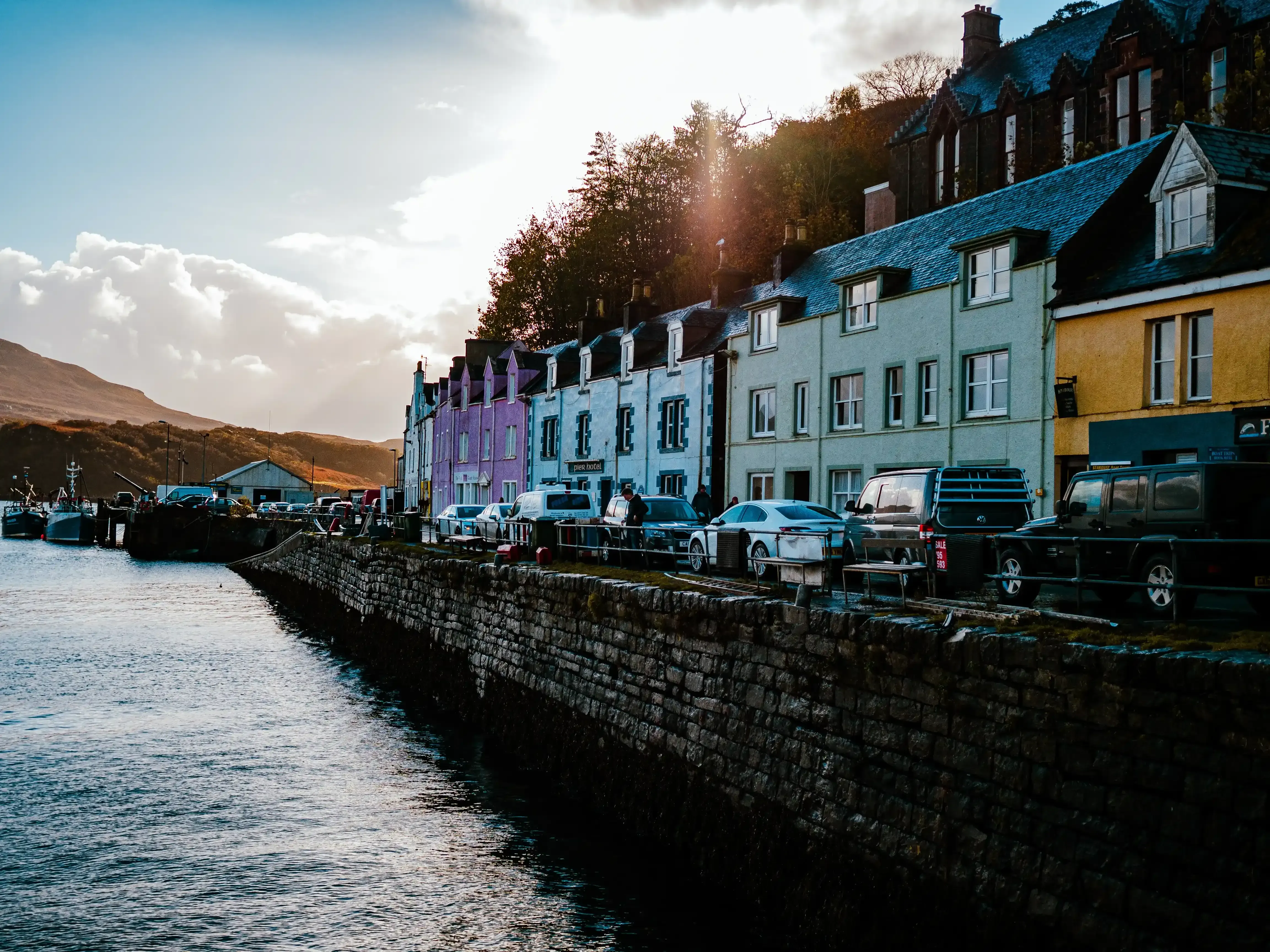 The colorful waterfront houses and harbor of the town of Portree on the Isle of Skye.