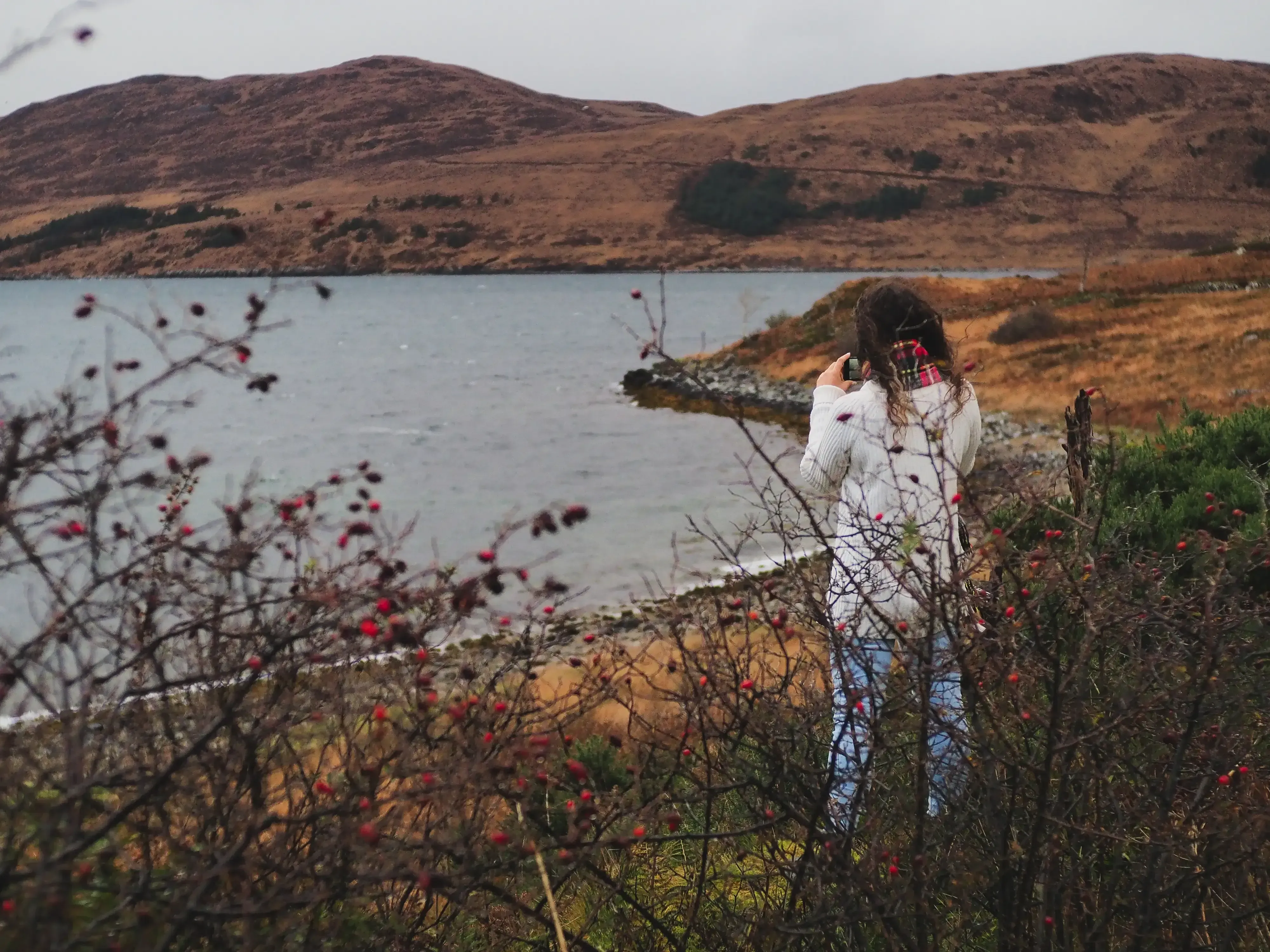Beatrice taking a picture of the view with her camera.