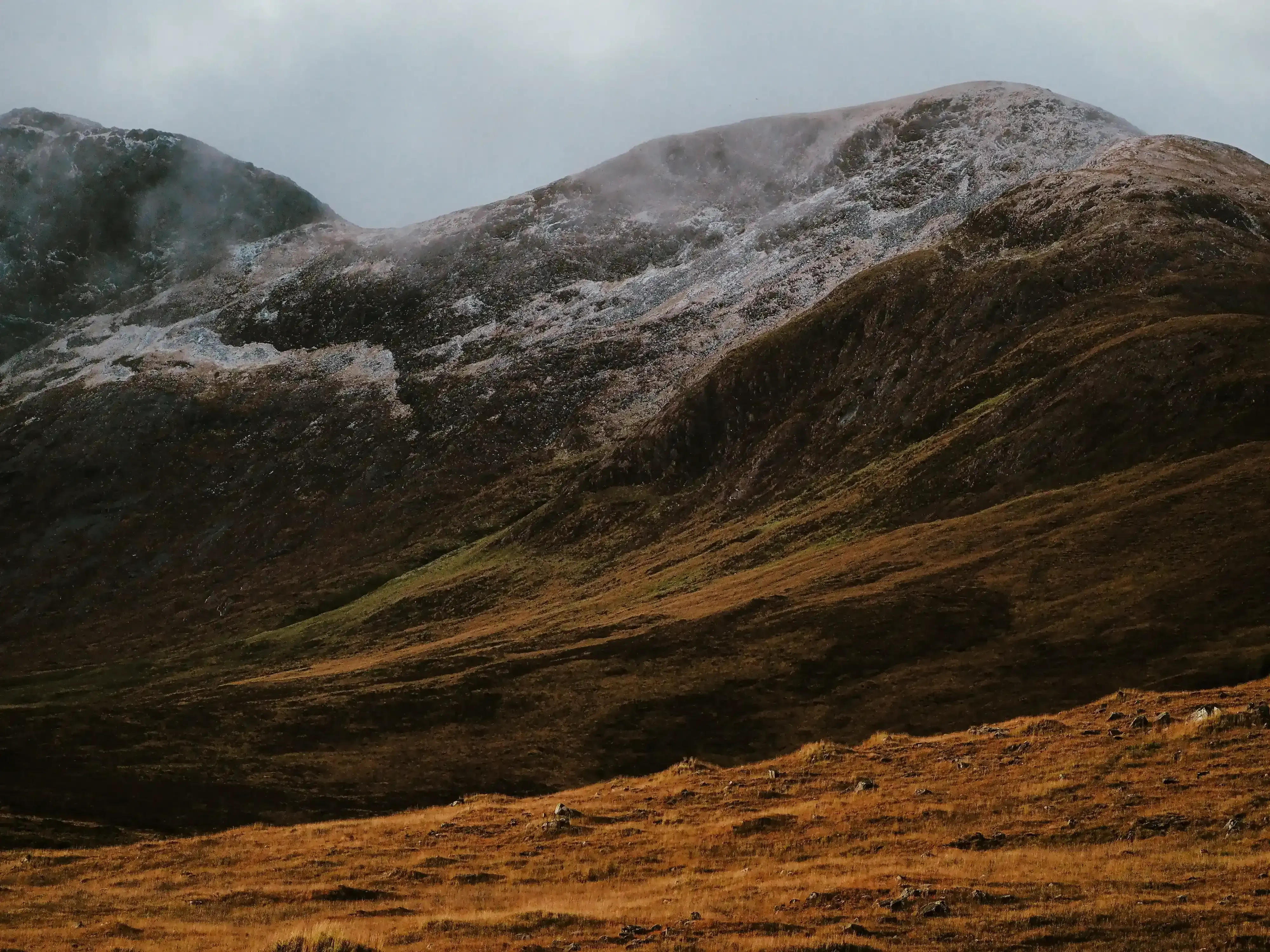 Majestic mountain with a fresh layer of snow covering the peaks.