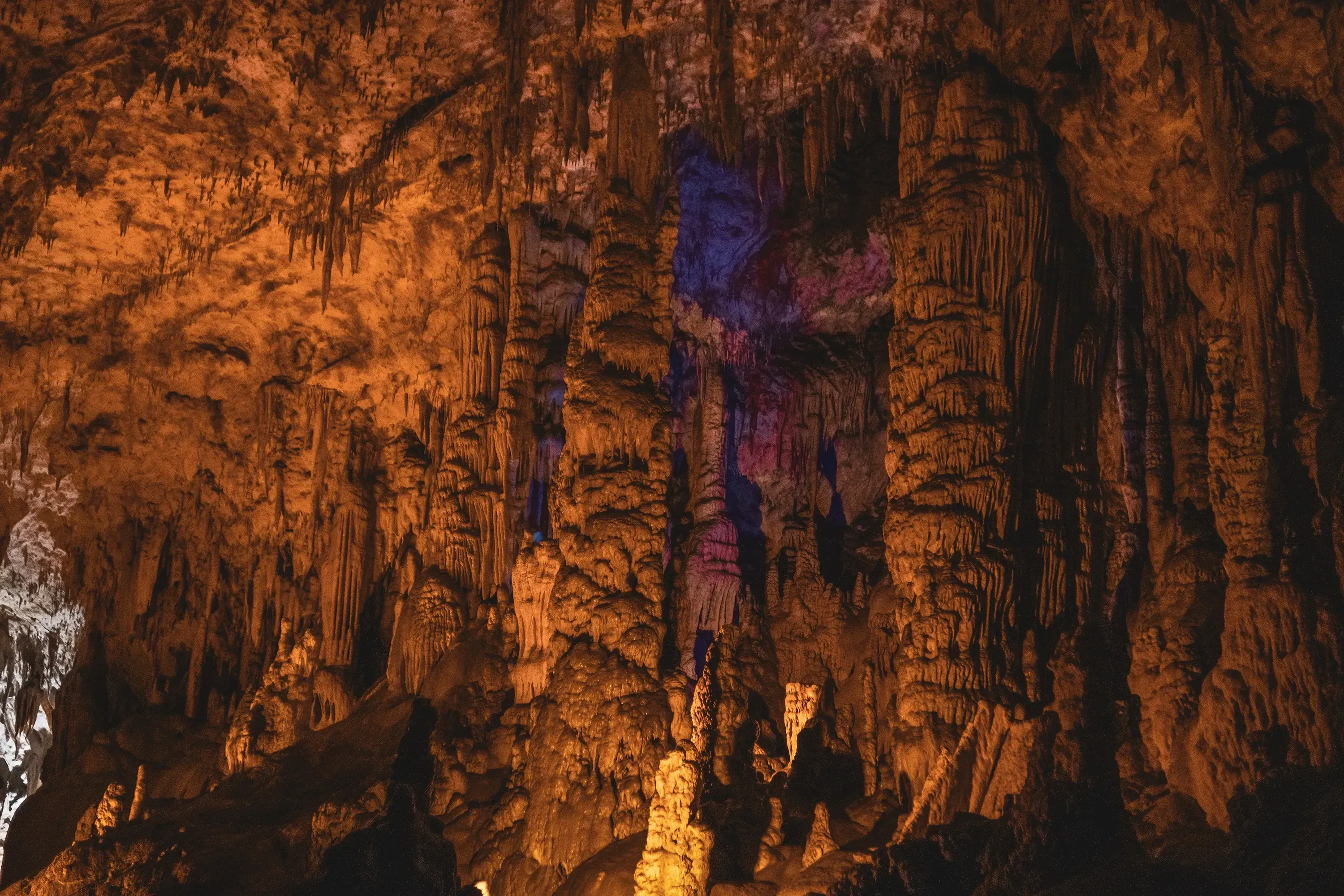 View of the illuminated main chamber and pathways deep inside the vast Postojna Cave system.