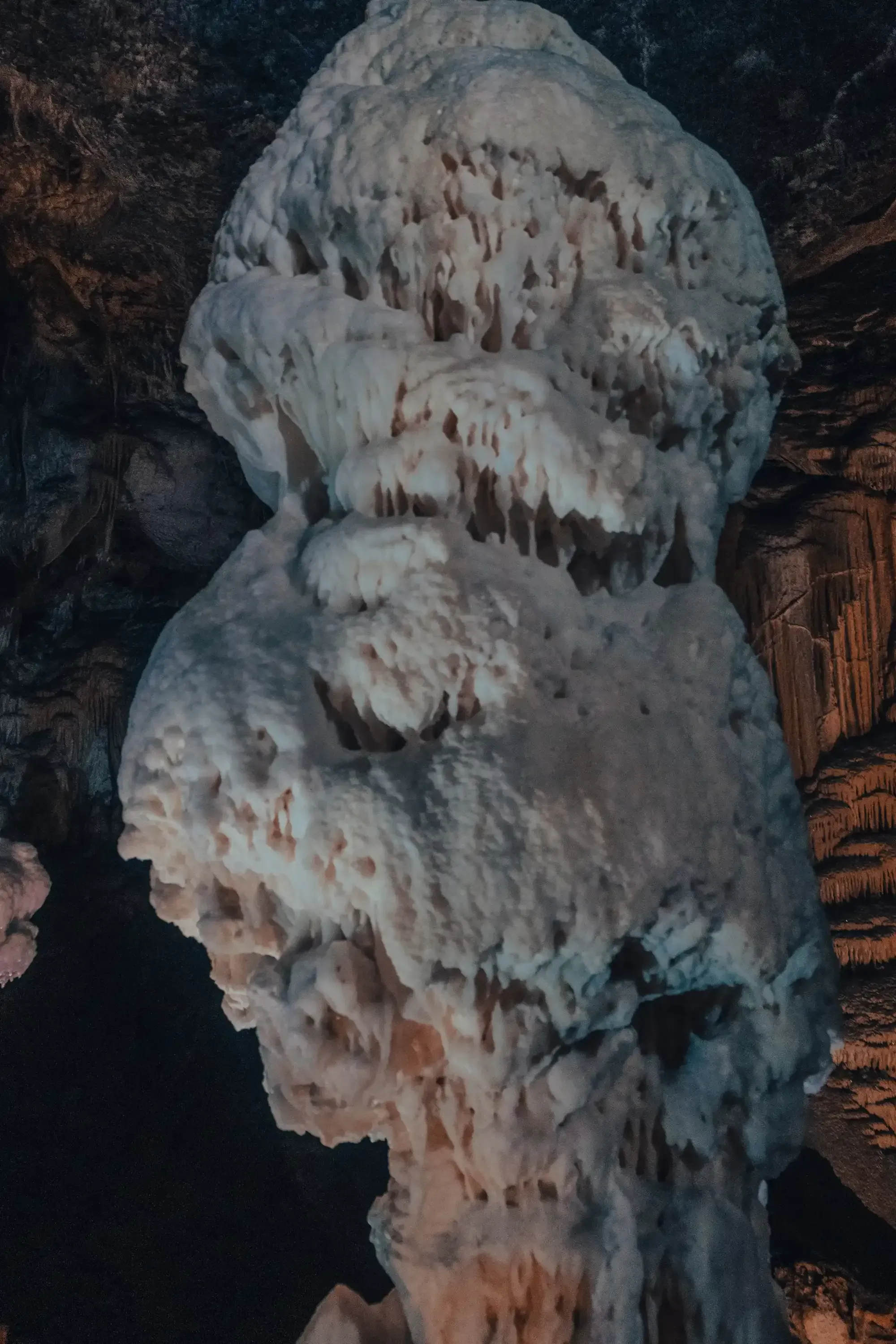 The massive, brilliant white stalagmite formation (known as the Diamond or Crystal) deep inside Postojna Cave.