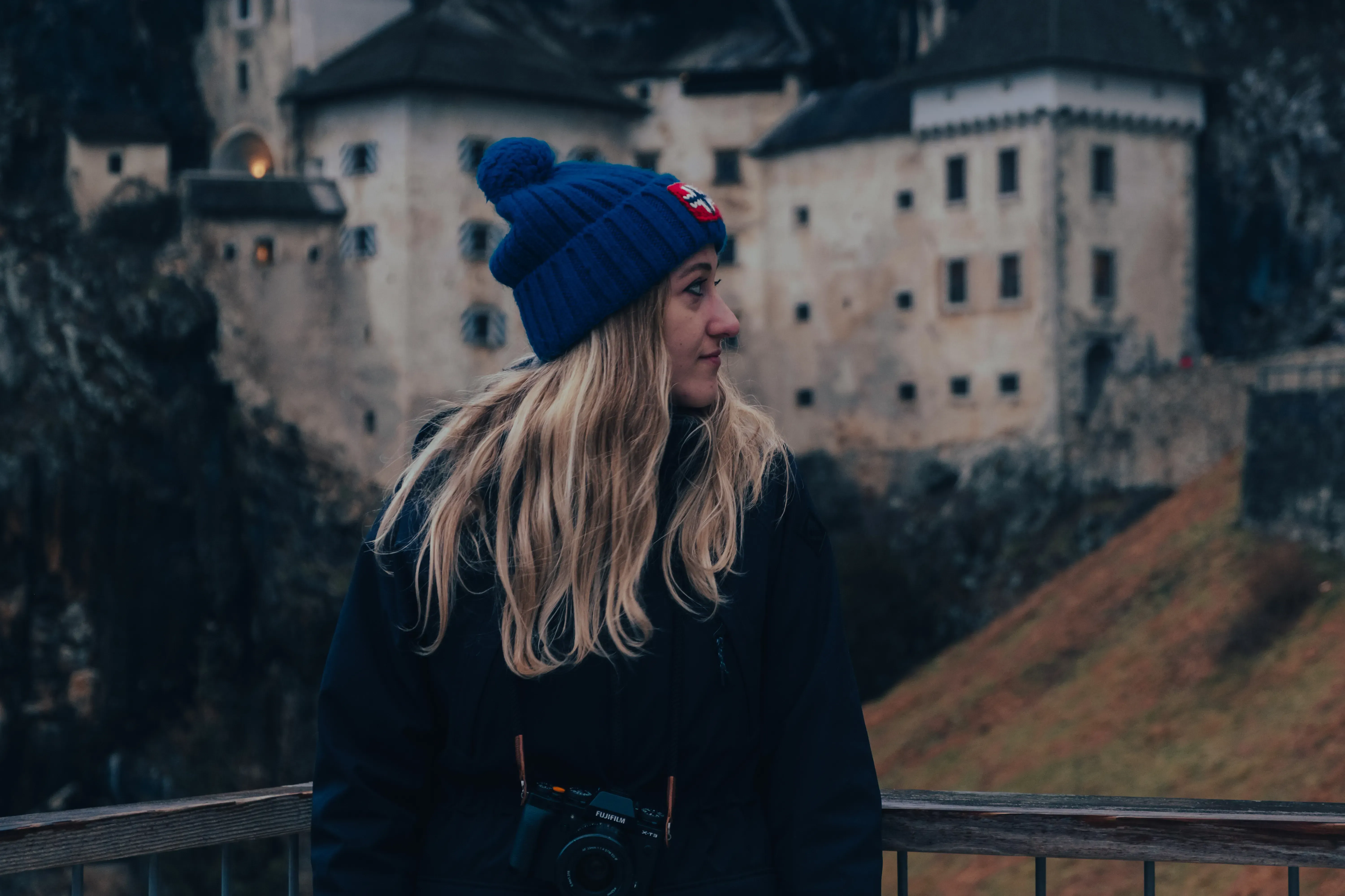 Letizia standing outside the impressive entrance building of Predjama Castle.