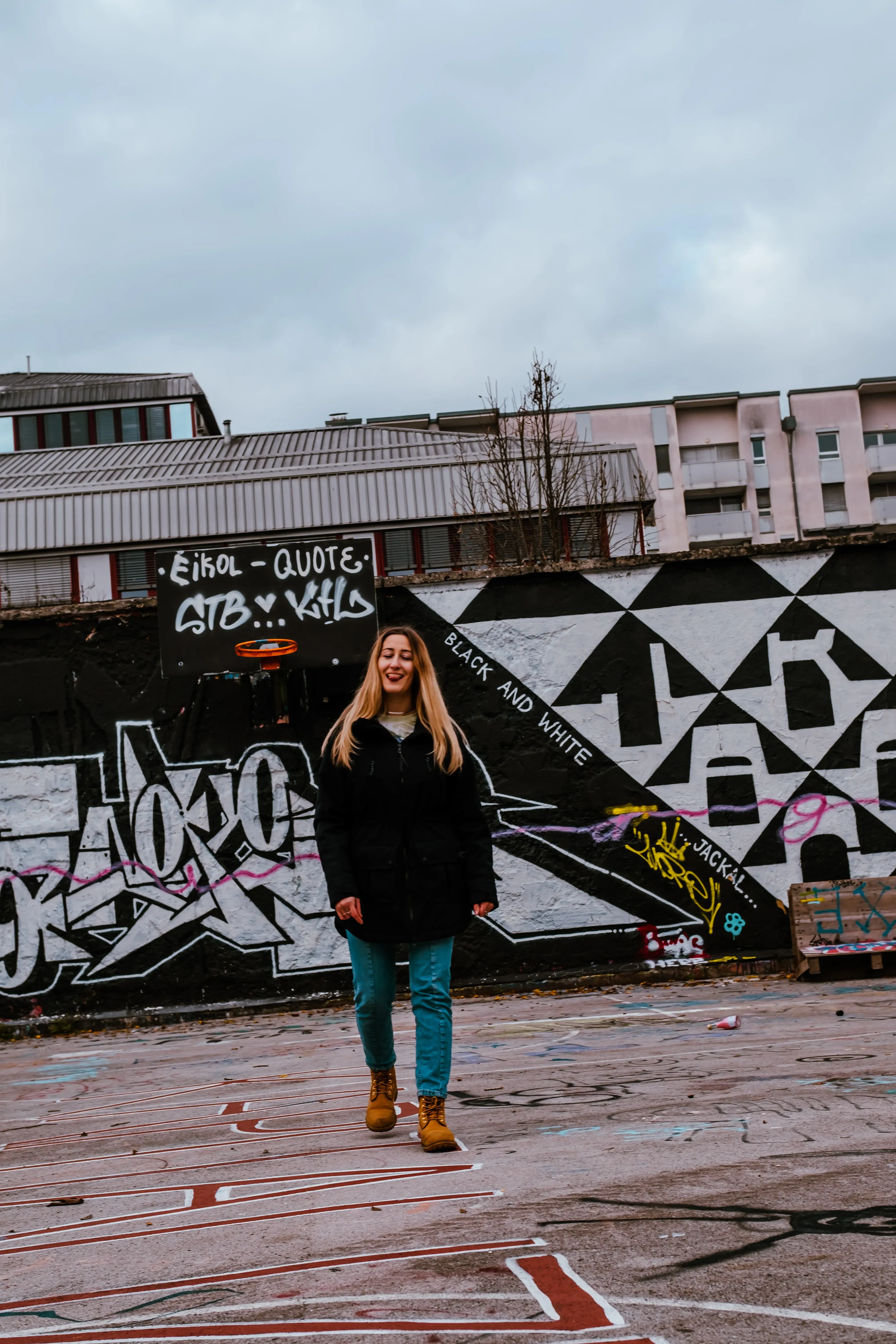 Letizia posing on the basketball court located in Metelkova.
