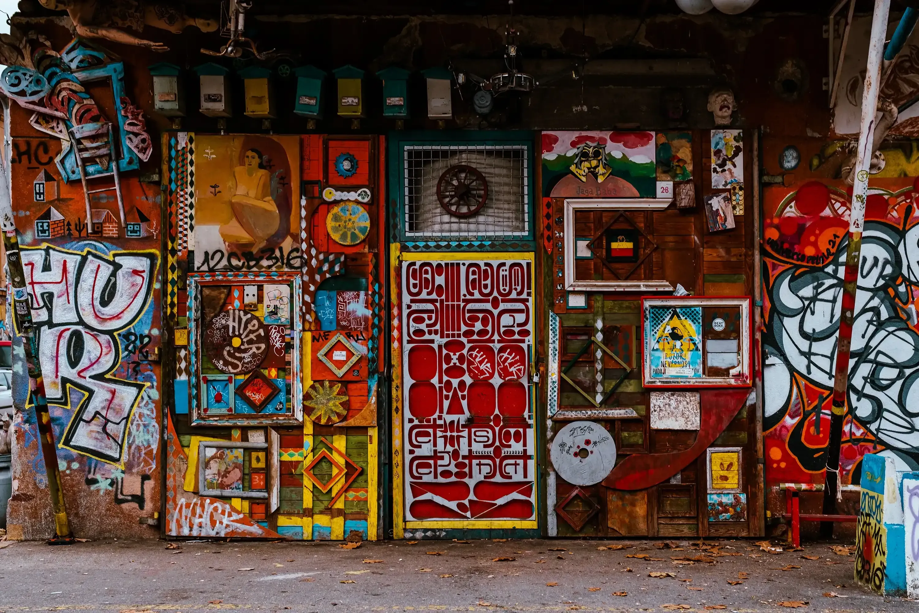 A brightly painted or decorated doorway in a characteristic street view of Metelkova.