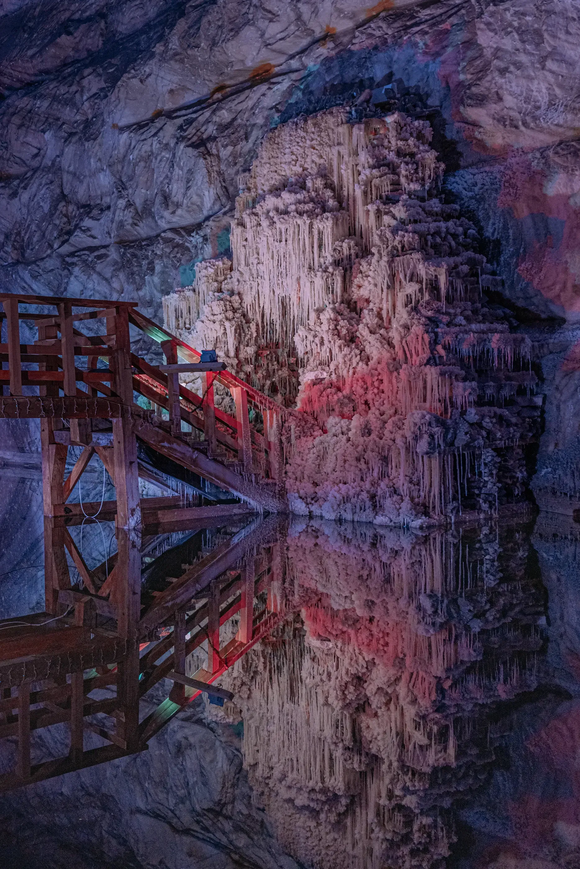 The vast, brightly lit, underground caverns or chambers of a Romanian salt mine