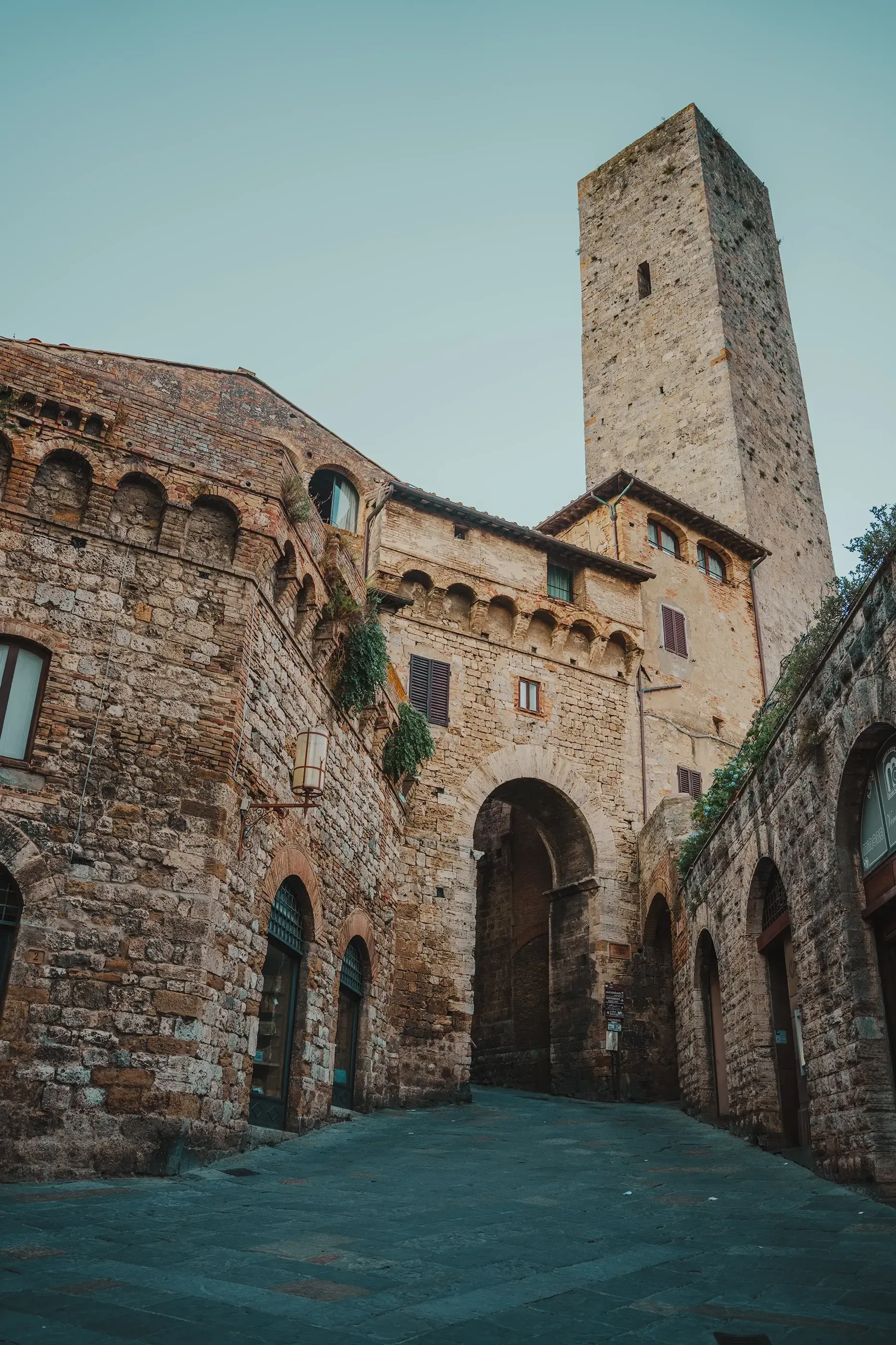 Close-up of one of the medieval stone towers defining the skyline of San Gimignano.