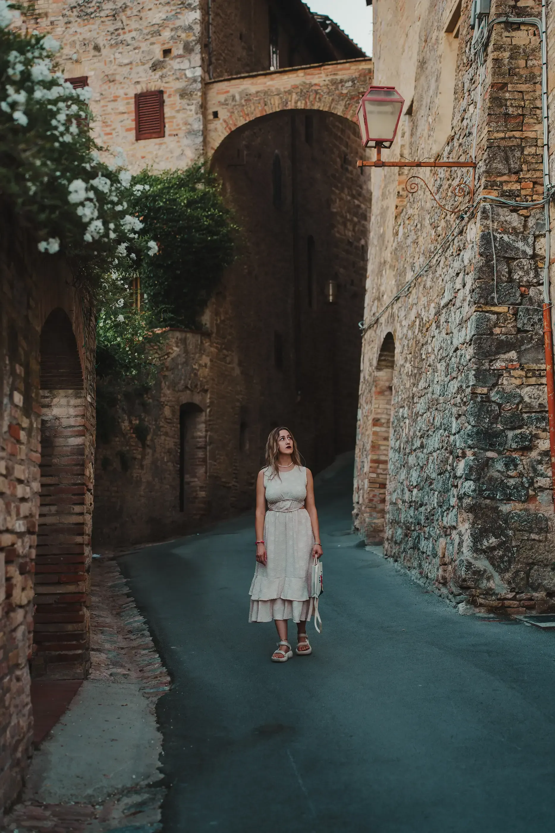 Letizia walking through one of the charming, narrow streets of San Gimignano.