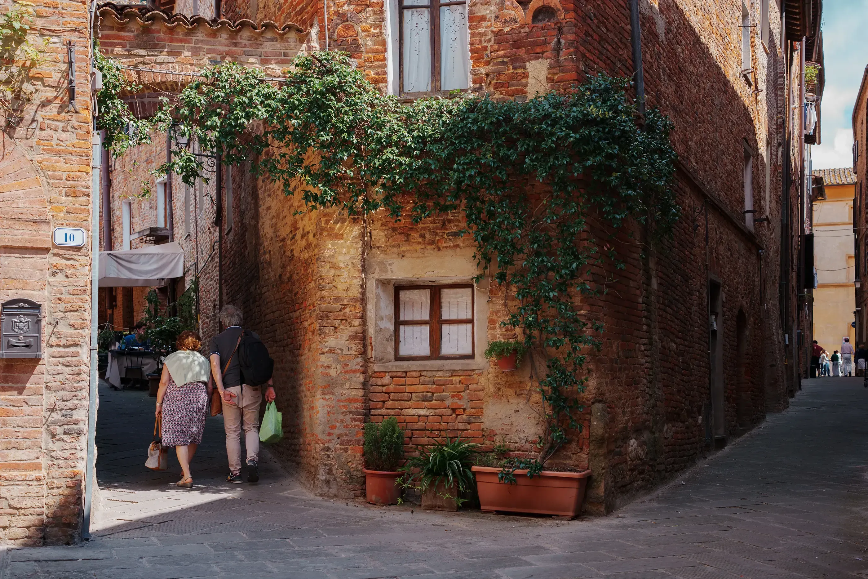 Narrow, ancient alleyway (vicolo) winding through the historic center of Perugia.