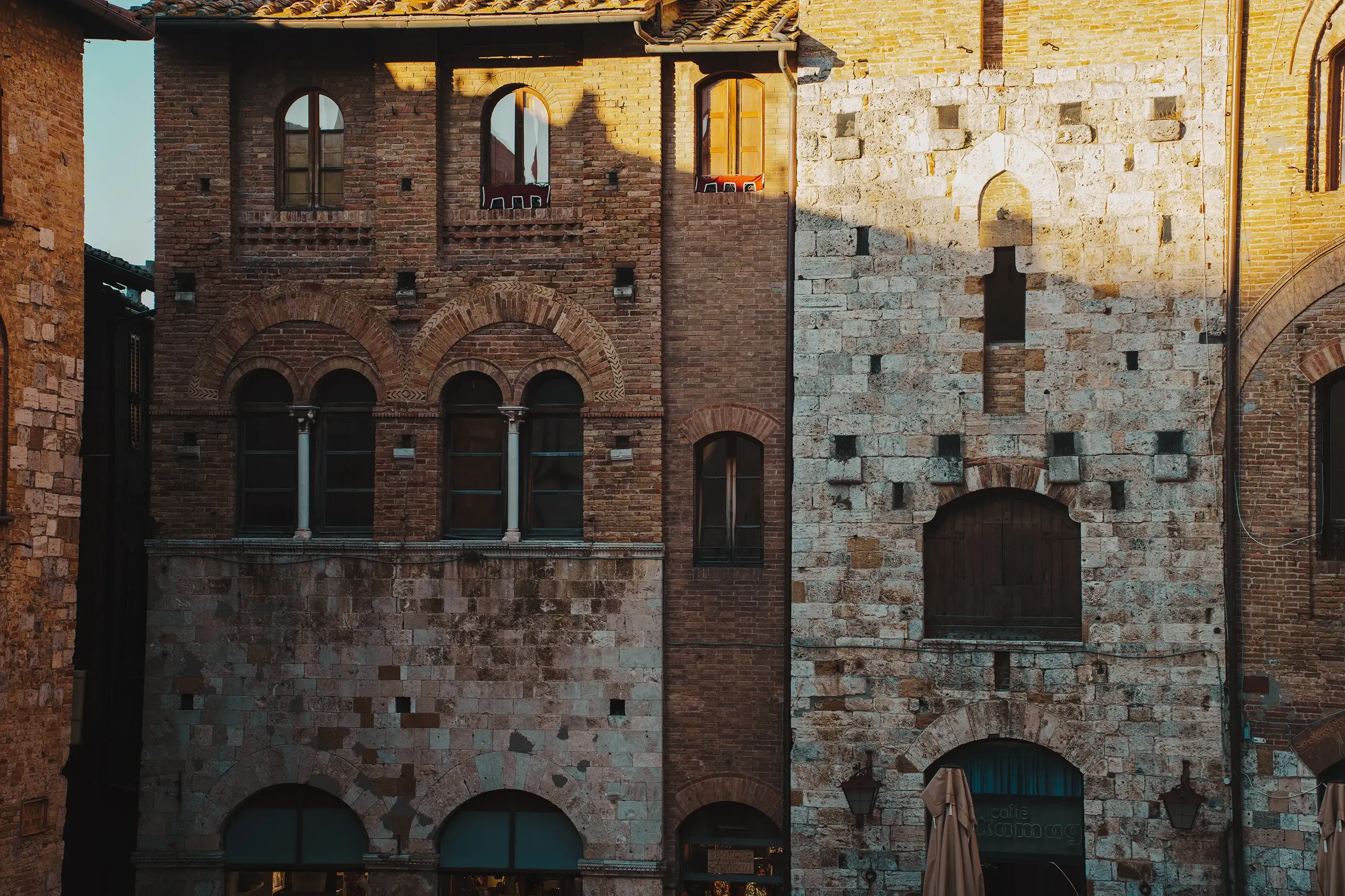 Close-up of the ancient stone houses and walls within the town of San Gimignano.