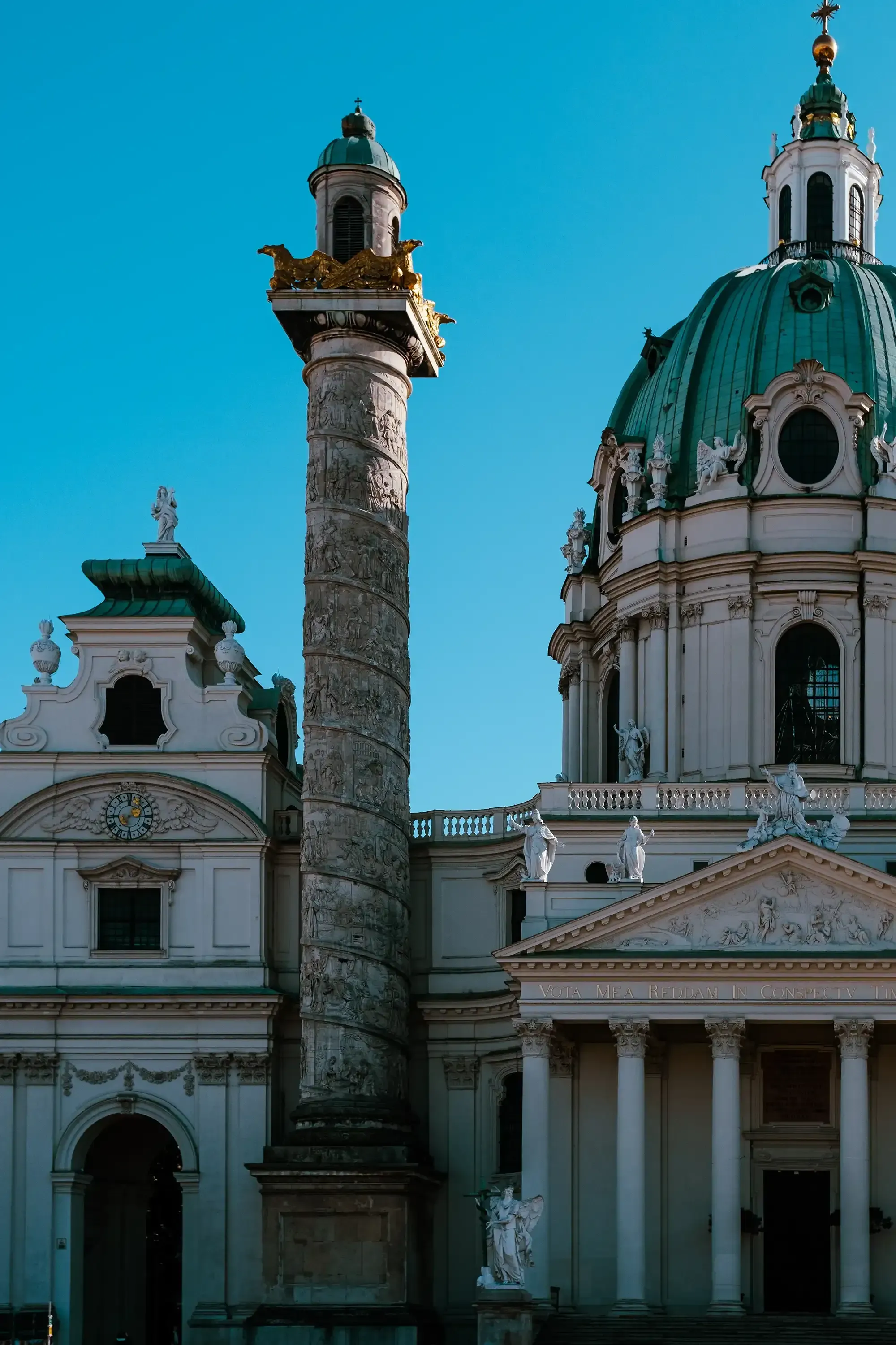 The famous chapel (possibly Karlskirche) with the prominent obelisk or column nearby.