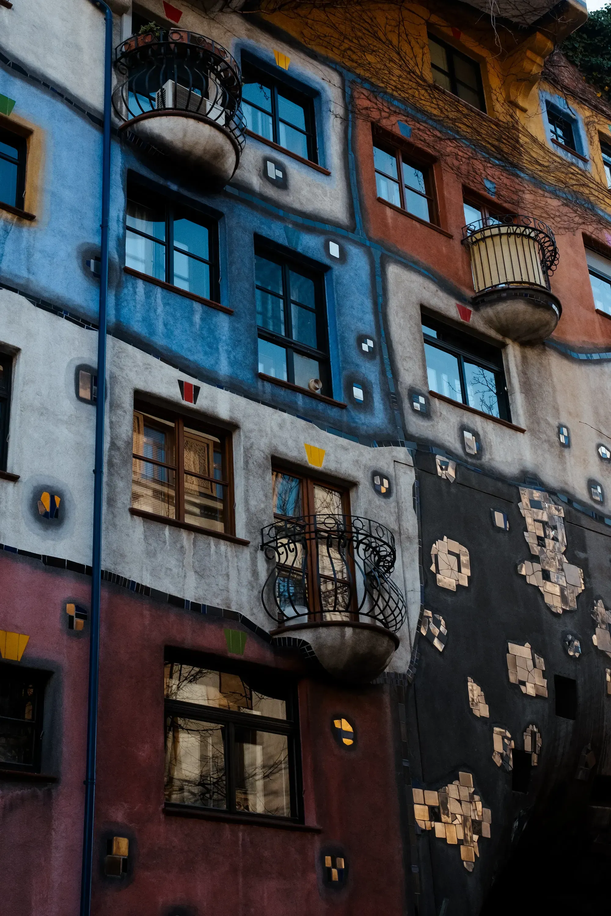 Detail of a window on one of the crooked, colorful houses (Hundertwasser House).