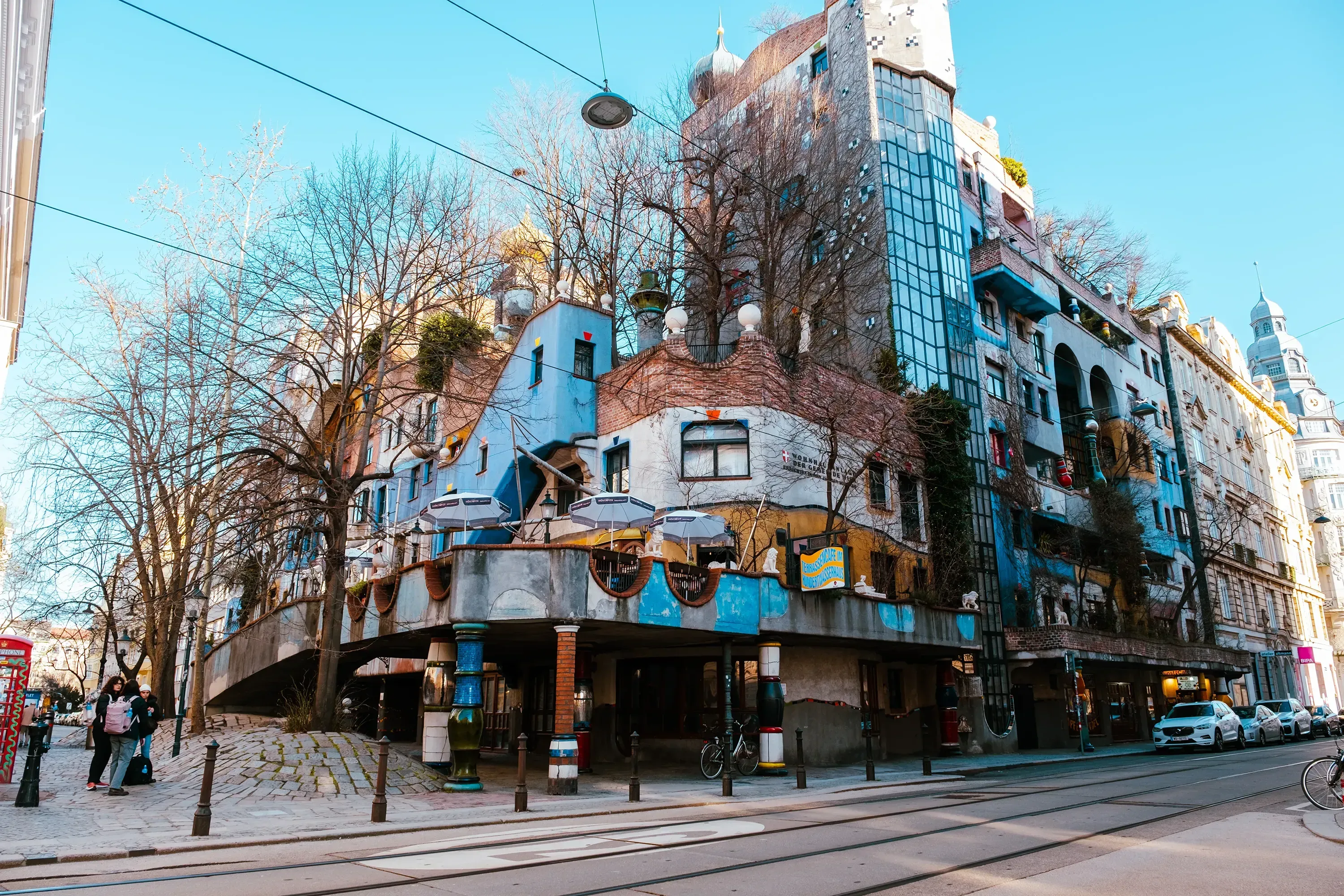 The facade of the unconventional, crooked, and undulating Hundertwasser House complex.