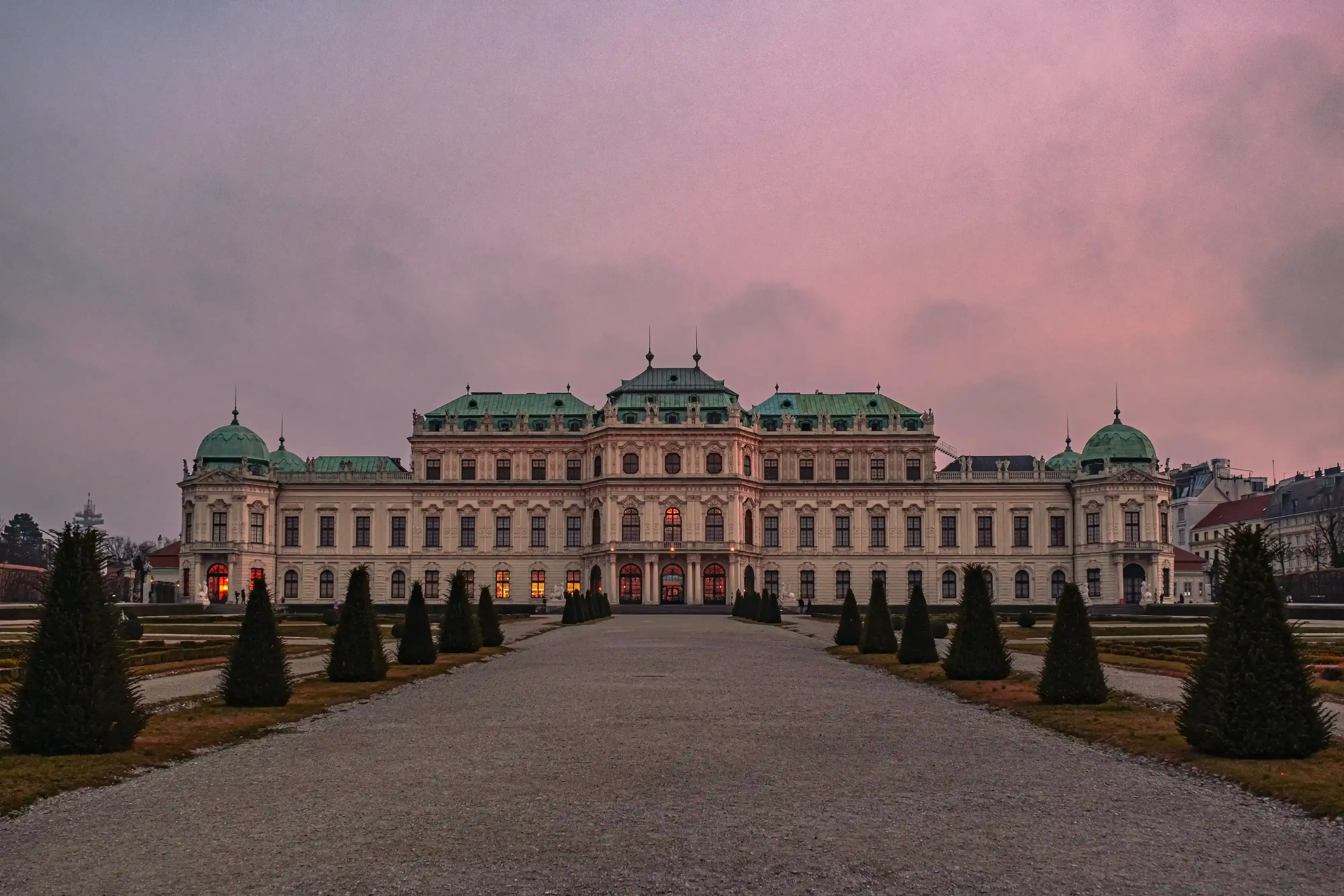 The Belvedere Palace in Vienna illuminated by the warm light of sunset.