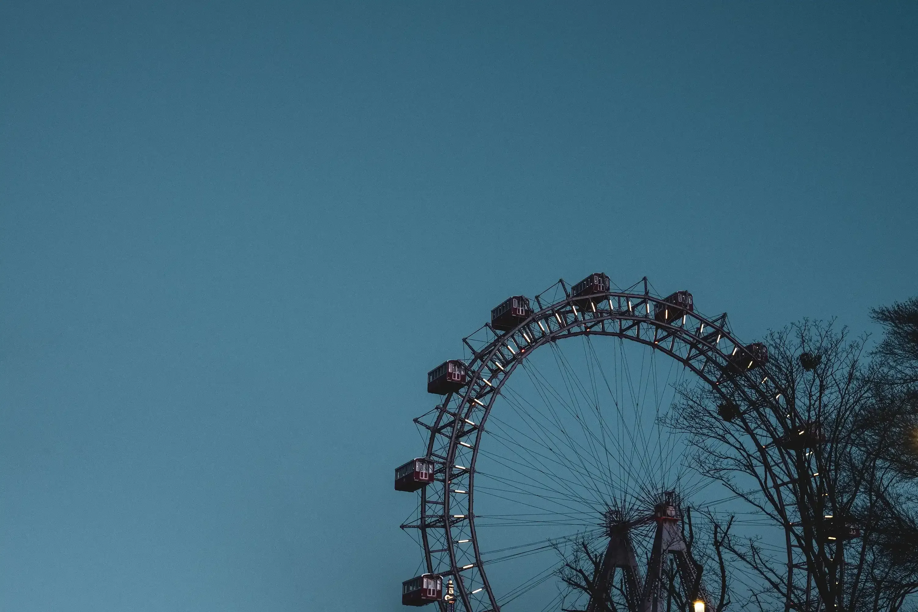 The Giant Ferris Wheel set against a bright, clear blue sky.
