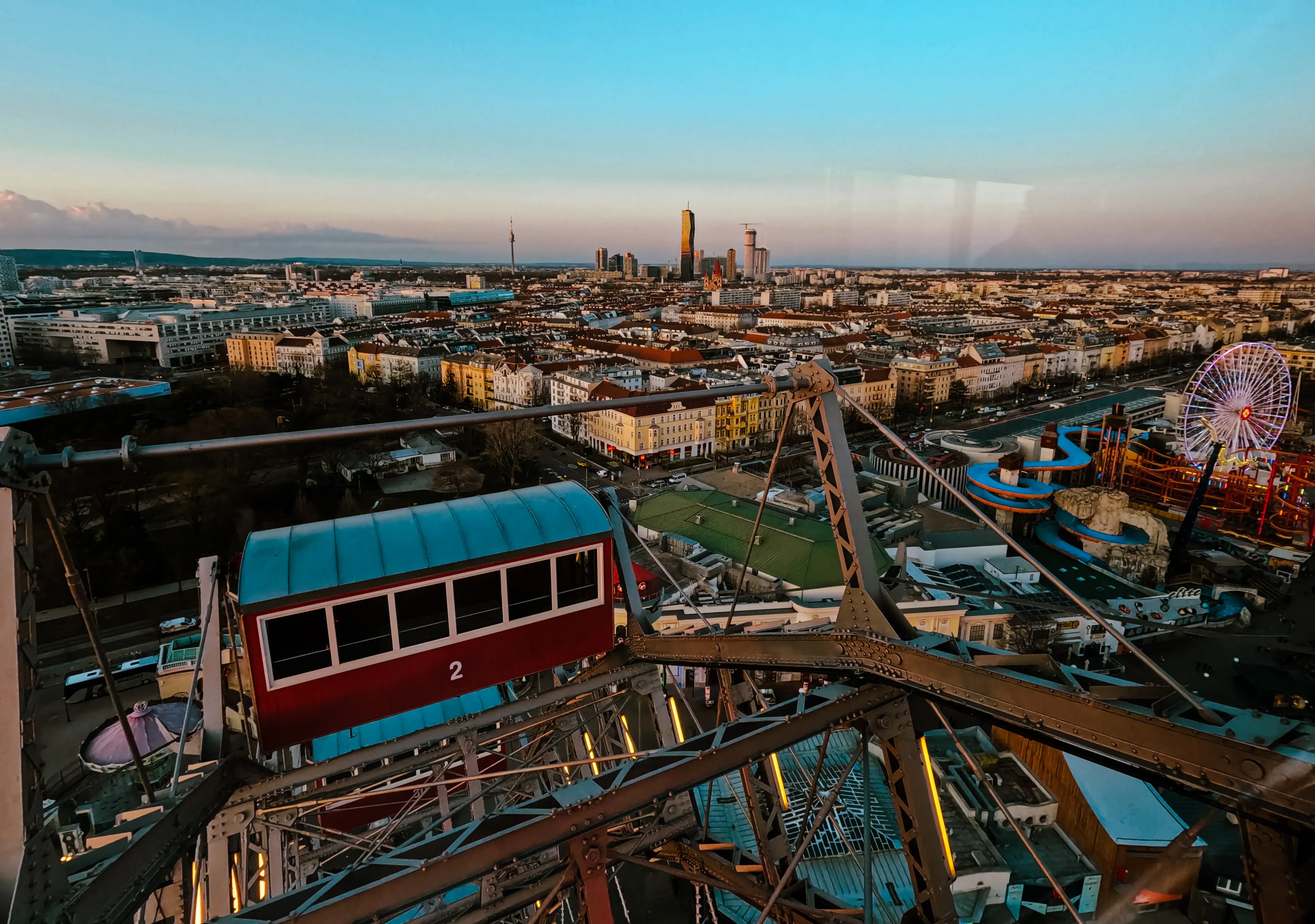 The large, distinctive red gondola cabins of the Giant Ferris Wheel (Riesenrad) at the Prater.